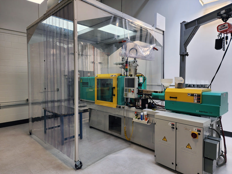 Injection molding machine inside VistaTek's cleanroom.
