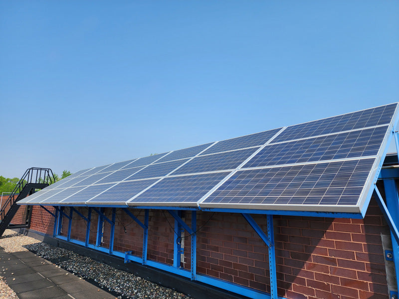 Solar panels installed on the rooftop of VistaTek's facility.