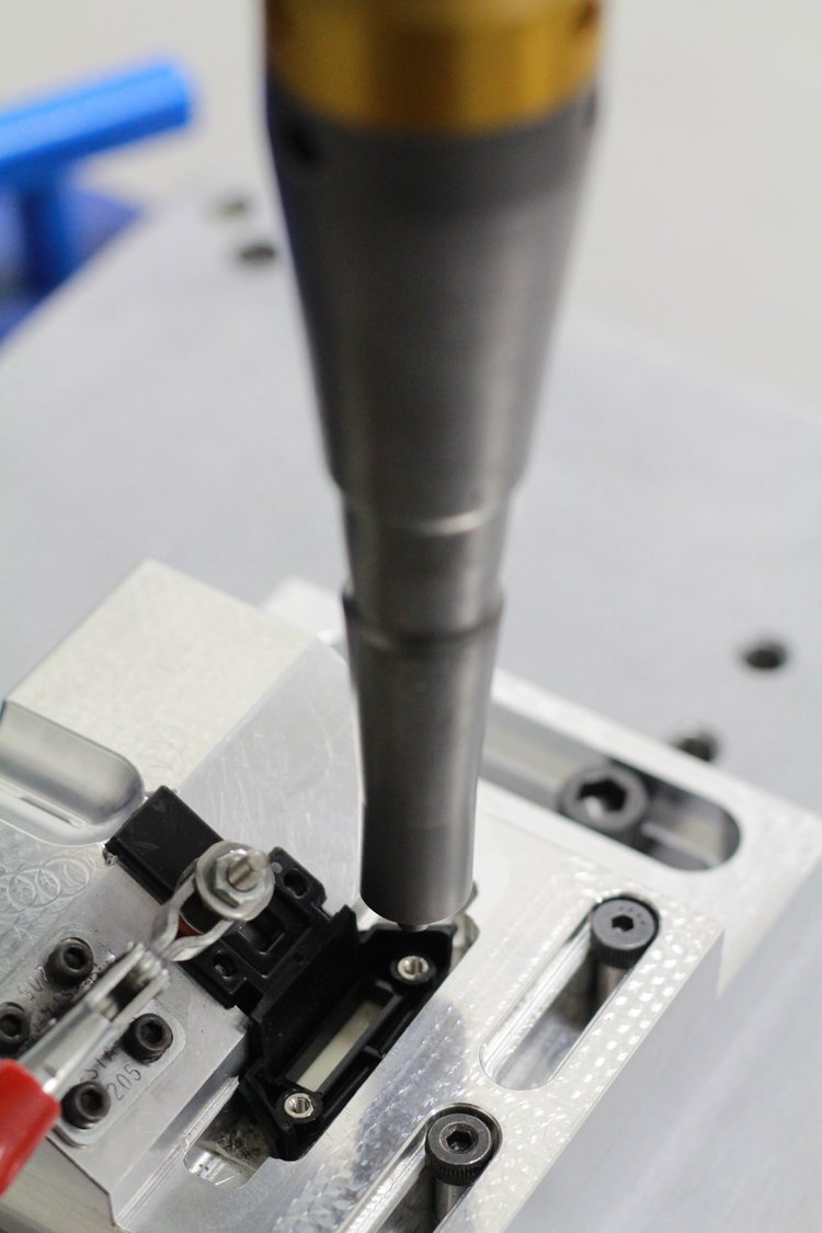 Close-up of a tool being used in a manufacturing process.